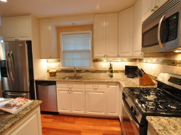 Giallo Fiorito Granite Countertops With White Cabinets